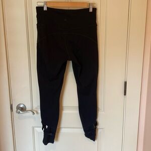 EUC Athleta black yoga exercise leggings with cutout and ribbon detailing